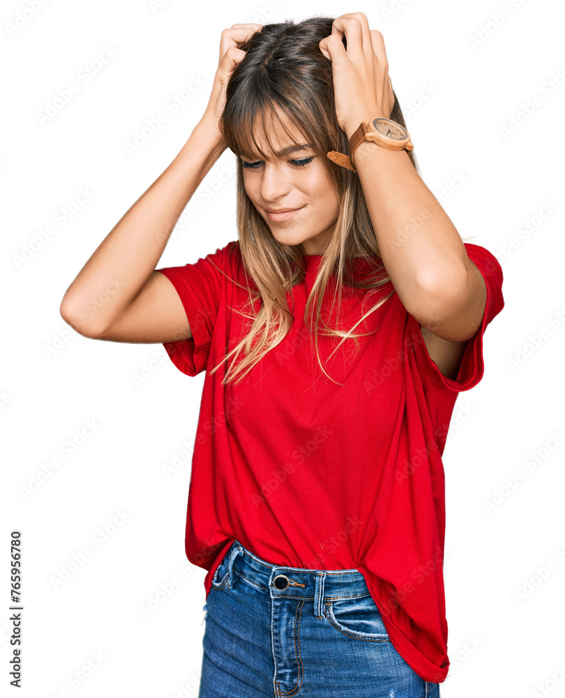 Teenager caucasian girl wearing casual red t shirt suffering from headache desperate and stressed because pain and migraine. hands on head. Teenager caucasian girl wearing casual red t shirt suffering from headache desperate and stressed because pain and migraine. hands on head.