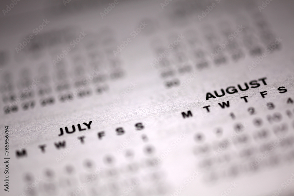 Calendar page - shallow depth of field - focus on July August month Calendar page - shallow depth of field - focus on July August month