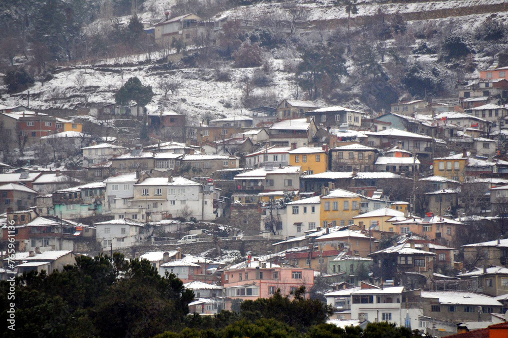 the city is snowed in, snow has accumulated on the roofs of houses