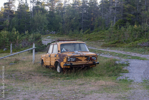 Rear view of the Russian Lada VAZ 2101 car, an old car rotting in the backwoods