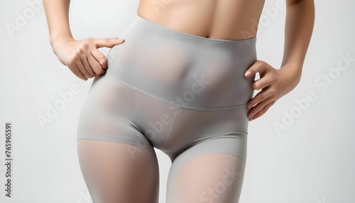 Close up of waist, belly and genital area of young woman wearing gray tights Isolated on white background created with generative ai © Chaudhry