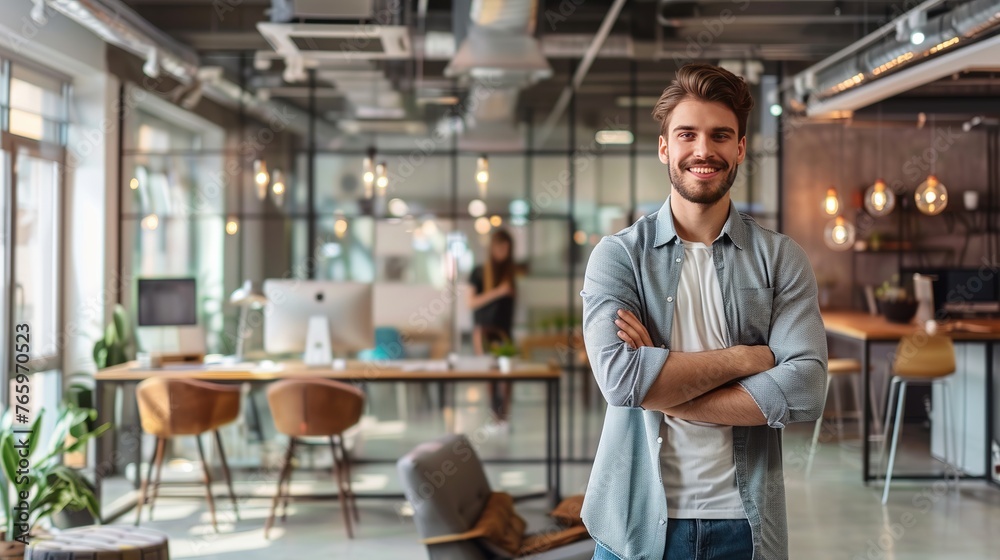 An image of a young businessman inside a modern coworking space, with plenty of open space on the walls, furniture, and equipment. An image of a young businessman inside a modern coworking space, with plenty of open space on the walls, furniture, and equipment.