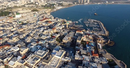 Panoramic Aerial View of Acco, Acre, Akko old city with crusader palace, city walls, arab market, knights hall, crusader tunnels, in Israel. Green Roof Al Jazzar Mosque photo