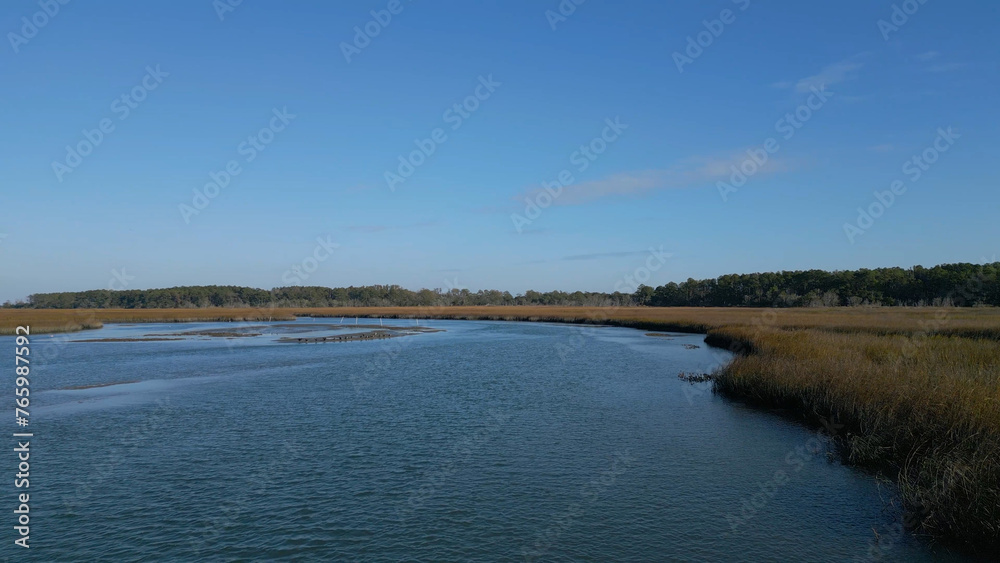 Aerial view over marsh on sunny day Aerial view over marsh on sunny day