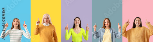 Collage of women with raised index fingers on color background