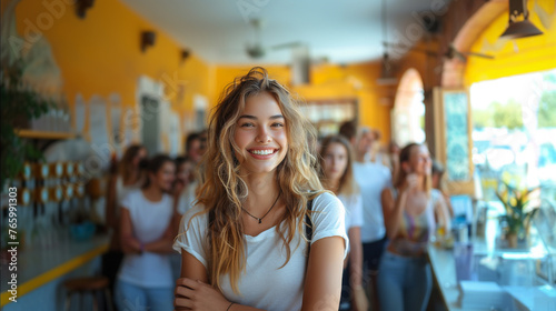 20s beautiful young white woman, student, smiling at camera, her classmates in the background. 
