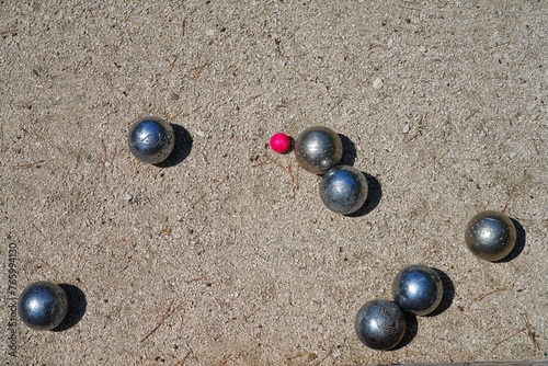 Playing a game of boules bocce ball (also called pétanque) in Provence, France © eqroy