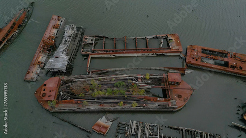 Remains of ship vessels disintegrating in harbor © Daniel Merlin Miller