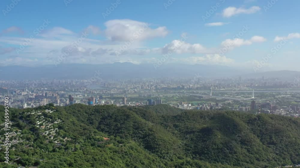 Mountain and Taipei City Cityscape in Taiwan. Green Park in Foreground. Business District in Background Mountain and Taipei City Cityscape in Taiwan. Green Park in Foreground. Business District in Background