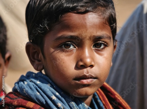 A refugee child looks into the camera