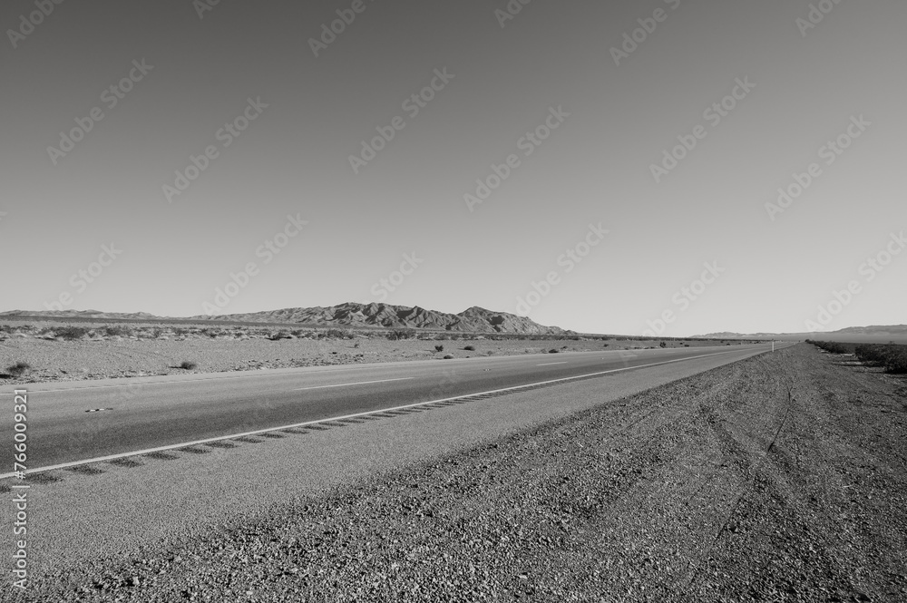 Highway 95 south of Las Vegas, near Boulder City, in the Nevada desert.  Black and white image.