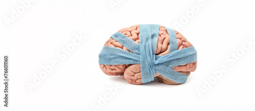 Human Brain with Blue Bandage on White Seamless Background. Representing Mental Health, Concussion, & Brain Damage. Room for Copy & Text