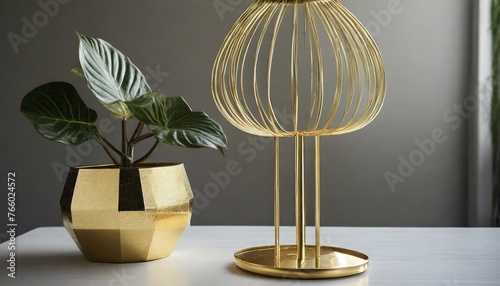 an elegant gold metal plant stand paired with a matching gold flower pot holder, showcasing a sleek and minimalist design with clean lines and geometric shapes, offering a contemporary aesthetic suita photo