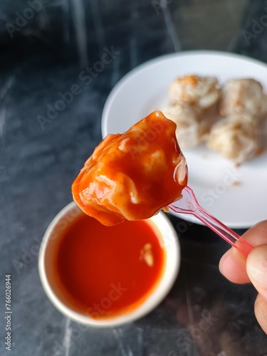 Dumplings with chili sauce.