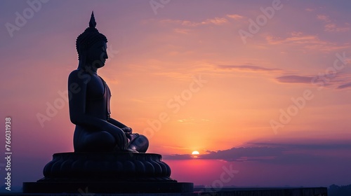 Silhouette of Buddha with sun shining from behind