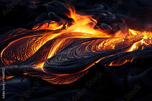 The dynamic flowing movement of a lava flow at night