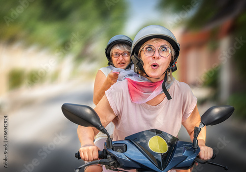 Seniors friends on the bike on the road © Vasleriia Kuznetsova