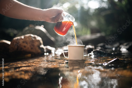 A man is pouring coffee int...