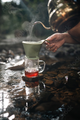 A man is pouring coffee int...