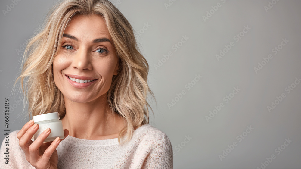 beautiful middle-aged adult woman with face and skin cream in her hands, taking care of the skin and preventing aging, fighting wrinkles beautiful middle-aged adult woman with face and skin cream in her hands, taking care of the skin and preventing aging, fighting wrinkles