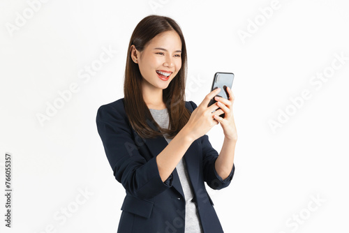 Beautiful Asian businesswoman holding smartphone and smiling on white background.