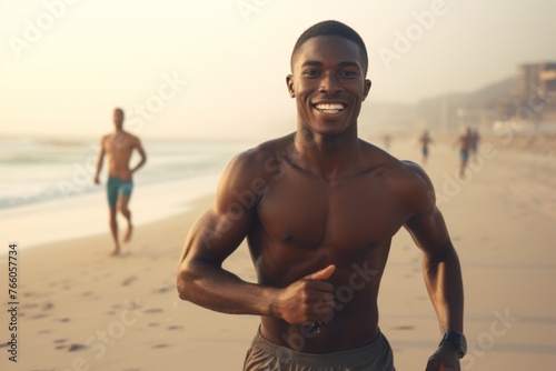 Portrait of happy man running on the beach