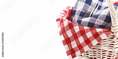 Wicker picnic basket with blue and red checkered cloth on a white background, ideal for outdoor themes.