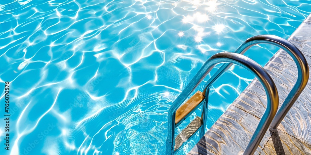 Swimming pool ladder leading into clear blue water, reflecting sunlight and inviting relaxation.