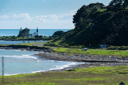 Coastal road and church in Raukokore, Bay of Plenty, New Zealand. photo