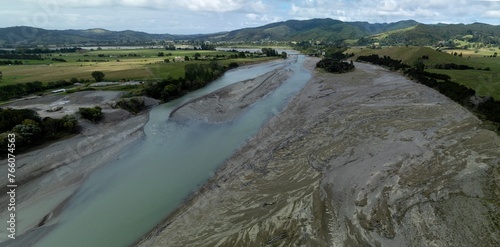 Waiapu River and farmland in Ruatoria, Gisborne, New Zealand. photo