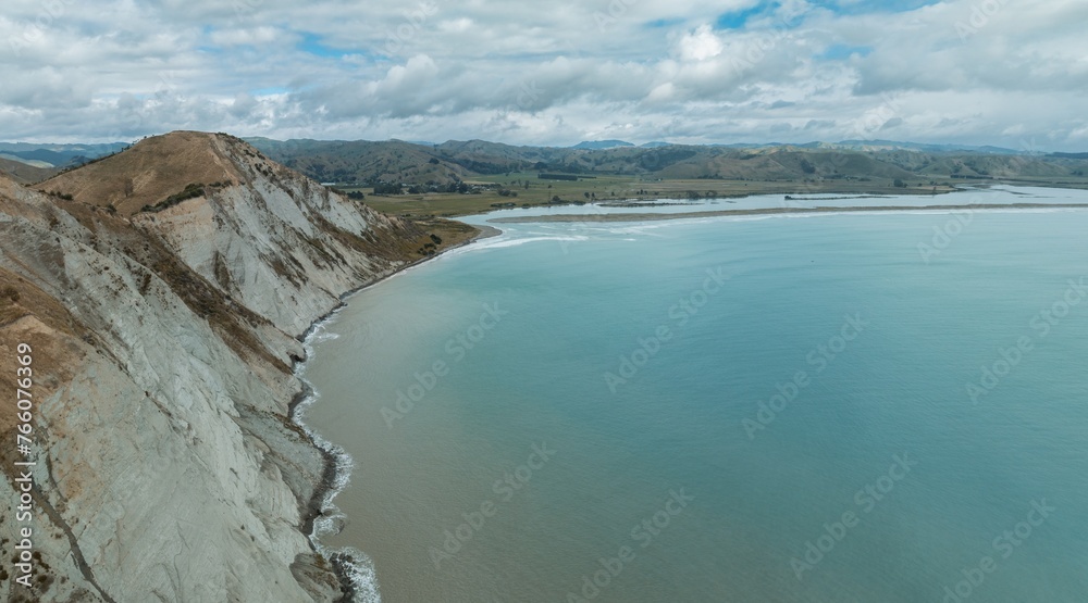 The rocky coastline and ocean headland of Young Nicks Head in Poverty Bay,, Gisborne, New Zealand. coastline and ocean headland of Young Nicks Head in Poverty Bay,, Gisborne, New Zealand. The rocky coastline and ocean headland of Young Nicks Head in Poverty Bay,, Gisborne, New Zealand. coastline and ocean headland of Young Nicks Head in Poverty Bay,, Gisborne, New Zealand.