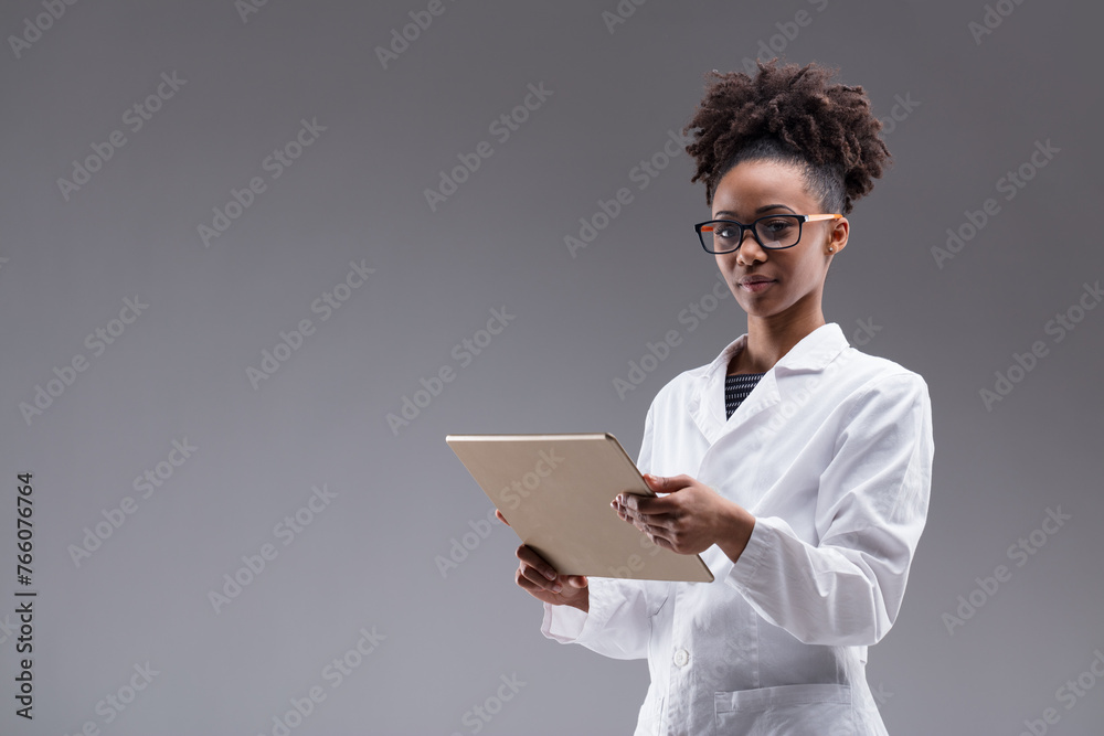 Inquisitive scientist studies tablet, bridging data and discover Inquisitive scientist studies tablet, bridging data and discover
