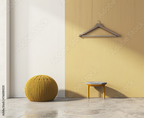 Minimalistic and modern interior design of the room, hanger on one wall, in yellow color, ballshaped seat made from knitted fabric in front of it photo