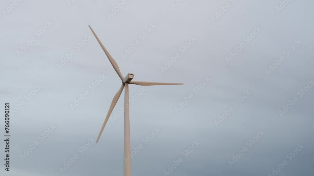 Slow motion 4k resolution video of 2ind turbine. No people. Renewable energies Slow motion 4k resolution video of 2ind turbine. No people. Renewable energies