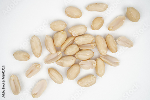 Group of roasted peeled peanuts isolated background