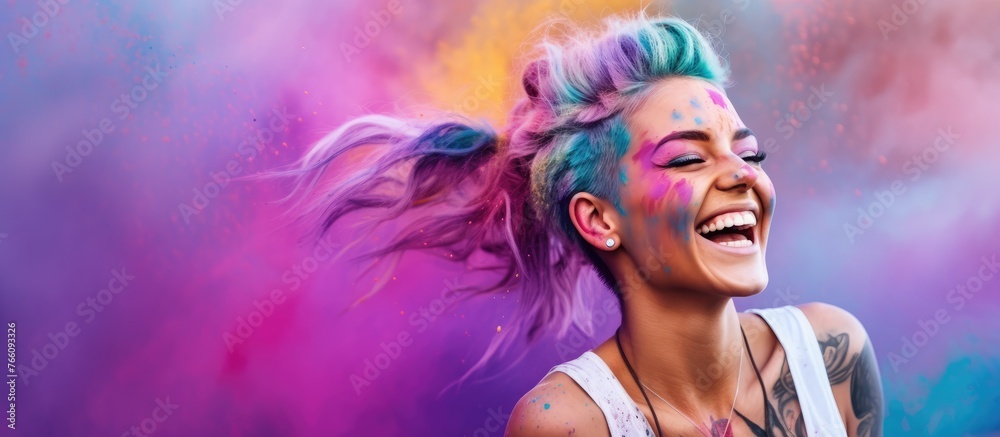 An upbeat woman with colorful hair and tattoos is smiling while holding a mobile device - obrazy, fototapety, plakaty 