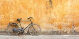 Vintage Bicycle Against Textured Yellow Wall