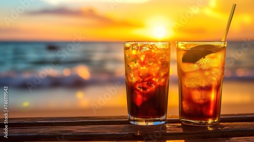 Tropical drink with vibrant garnish enjoys a sunset view on the beach photo
