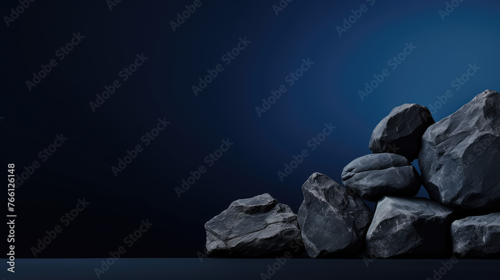 Dark navy blue stone on wooden table top, on dark abstract background from interior building banner background - can used for display or montage your products.