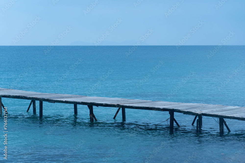 wooden bridge on the blue sea natural background