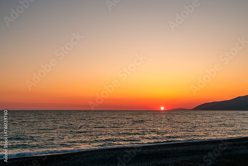 the horizon line on the sea and the sun