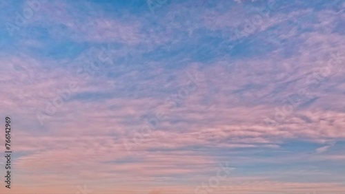 timelapse of the sky - violet sunset with overcast clouds - loop video