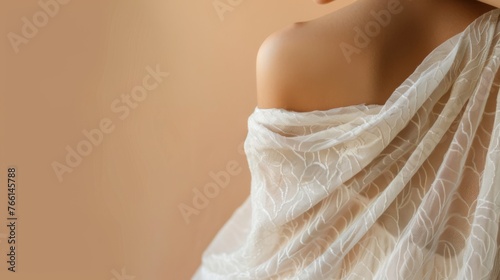 Sensitive female body on a beige background highlighting the elegance and sensitivity of the female form. Women's neck and shoulders