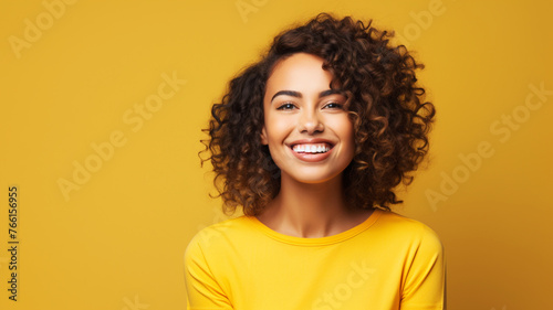 A happy Hispanic woman in her 30s smiling brightly photo