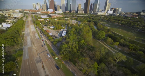 Wide angle reveal drone shot of downtown Houston, Texas and surrounding area