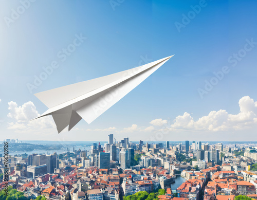 A paper airplane flying over a cityscape, symbolizing the freedom and agility in entrepreneurial pursuits