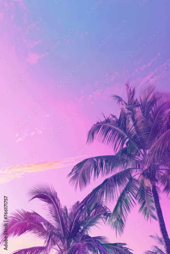 Palm trees standing tall against a colorful sky, blending shades of pink and blue in the background