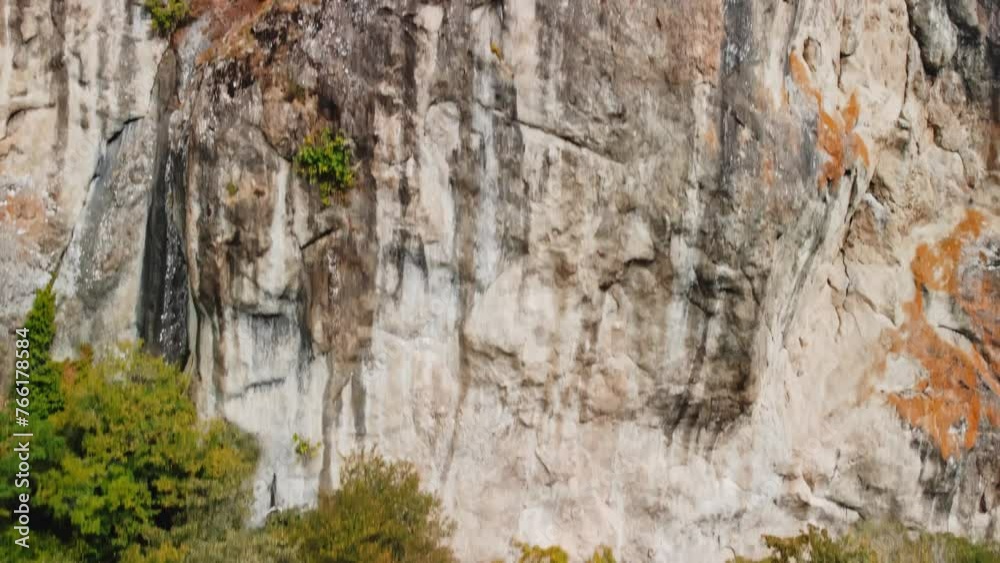 Closeup aerial view of majestic rock formations and trees growing nearby filmed in Georgia. Drone landscape of the mountains and cliffs in Birtvisi at autumn season. Extreme terrain for hiking Closeup aerial view of majestic rock formations and trees growing nearby filmed in Georgia. Drone landscape of the mountains and cliffs in Birtvisi at autumn season. Extreme terrain for hiking