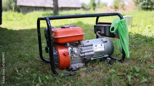 Gasoline-powered electric generator in a state of operation.