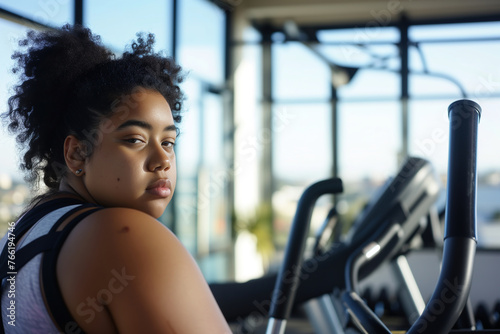 Portrait of a size plus black girl in the gym